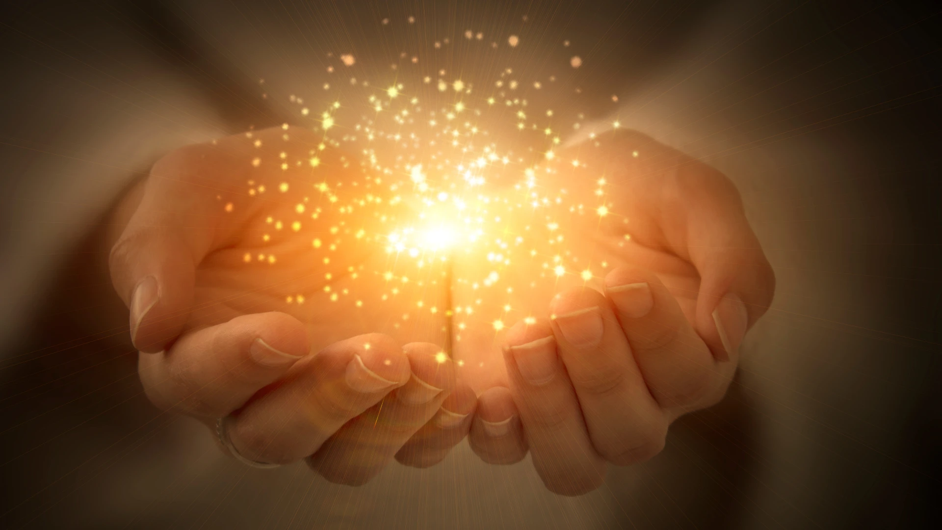 Hand mit einer glitzernden Kraft